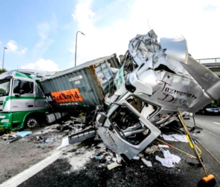 Two trucks badly crashed on a highway